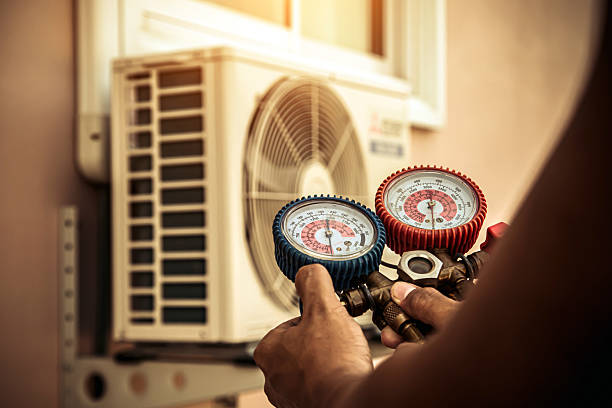 Professional Air Conditioning Service technician working in Maplewood, MN